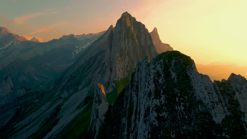 Sunset at Schaeffler mountain ridge swiss Alpstein, Appenzell Switzerland, a steep ridge of the majestic Schaeffler peak, Switzerland.  | Shutterstock HD Video #1099429415