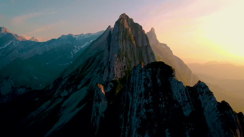 Schaeffler mountain ridge swiss Alpstein, Appenzell Switzerland, a steep ridge of the majestic Schaeffler peak, Switzerland. couple man and woman mid age in the mountains, man and woman hiking | Shutterstock HD Video #1099429437