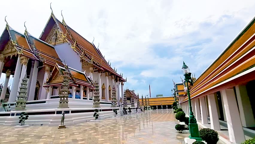 Thai Buddhist temple Bangkok Thailand, Wat Suthat, better known for the towering red Giant Swing that stands at its entrance, is one of the oldest and most impressive Buddhist temples in Bangkok