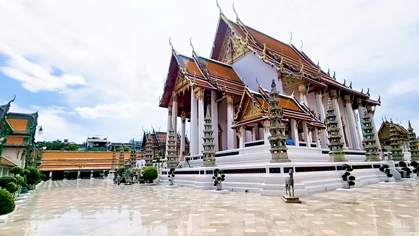 Thai Buddhist temple Bangkok Thailand, Wat Suthat, better known for the towering red Giant Swing that stands at its entrance, is one of the oldest and most impressive Buddhist temples in Bangkok