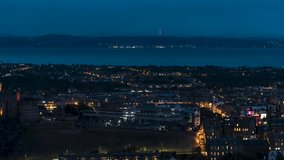 Establishing Aerial View Shot of Edinburgh UK, Scotland United Kingdom at night evening, center and suburbs