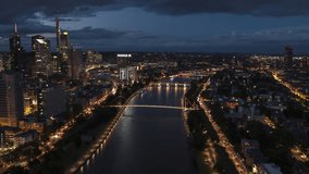 Establishing Aerial View Shot of Frankfurt am Main De, financial capital of Europe, Hesse, Germany, at night evening, super clear image, track along river