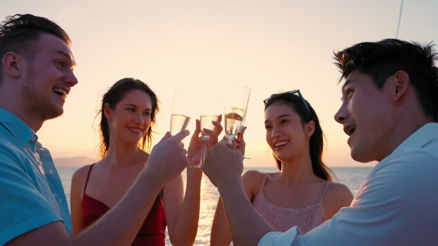Group of business friends together celebrating and enjoying party with drinking champagne on sail yacht, Outdoor lifestyle of the sea  and travel vacation concept | Shutterstock HD Video #1099433121