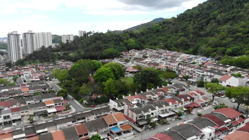 Bird eye view of tropical mountains and houses in Georgetown