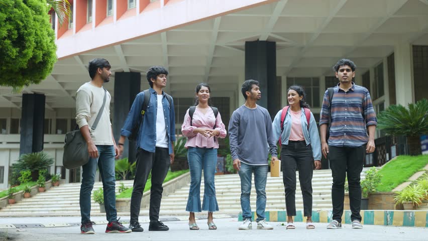 Cheerful group of graduated students jumping at college campus after completion of degree class or positive results - concept of freedom, aspirations and successful Royalty-Free Stock Footage #1099440759