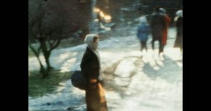 Woman walking street outdoors in lens flare. 1980s Kyiv, Ukraine. Happy smiling girl resting in spring park, winter city. Old family archives. Vintage, archival color film. Retro 80s historic archive