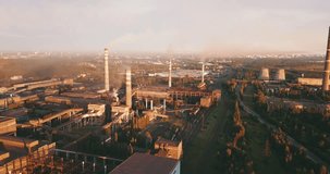 4K summer morning aerial video of smoking chimneys and panorama of metal plant