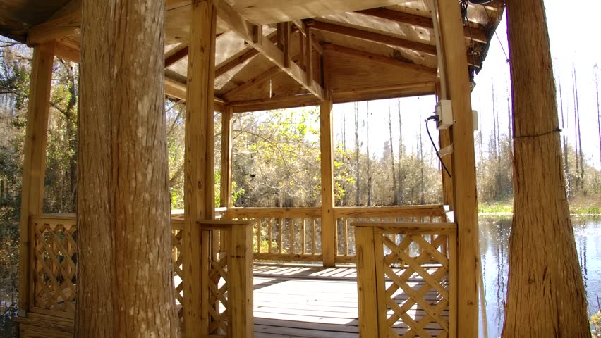 Wooden gazebo overlooking the fishing pond.