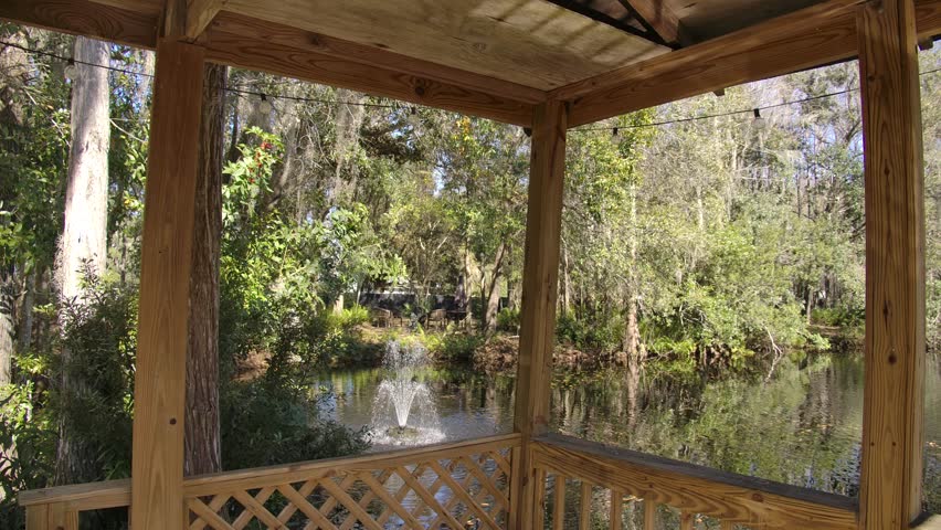 Wooden gazebo overlooking the fishing pond.