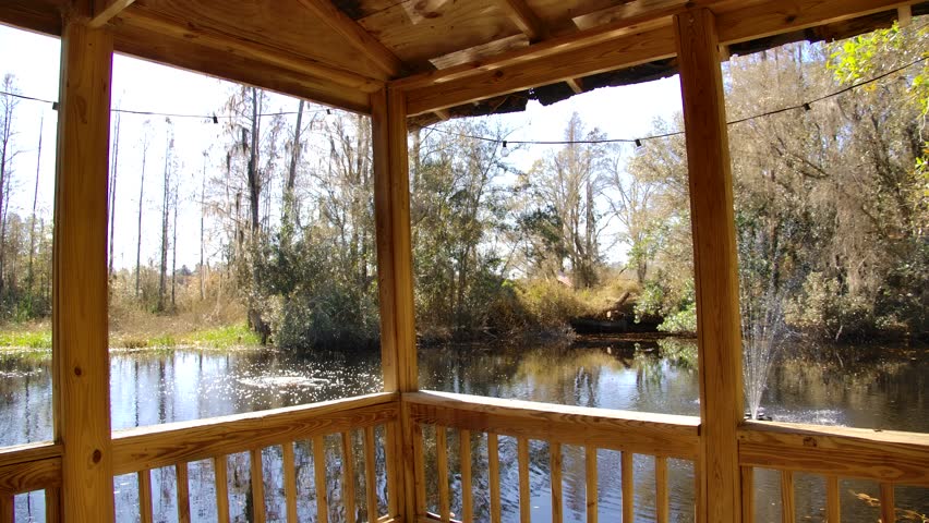 Wooden gazebo overlooking the fishing pond.