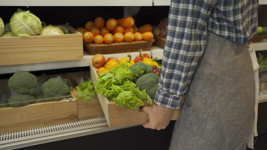 Portrait of a caucasian woman working in a supermarket or retail shop and food on grocery products. Food shopping. People lifestyle. Business service. A staff worker
