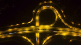 Beautiful top view time-lapse of car traffic at roundabout lane and buildings. 4K drone aerial zoom out. Urban cityscape concept or abstract of advanced innovation, financial technology, energy power - Powered by Shutterstock - Get 15% off with code: PIKWIZARD15