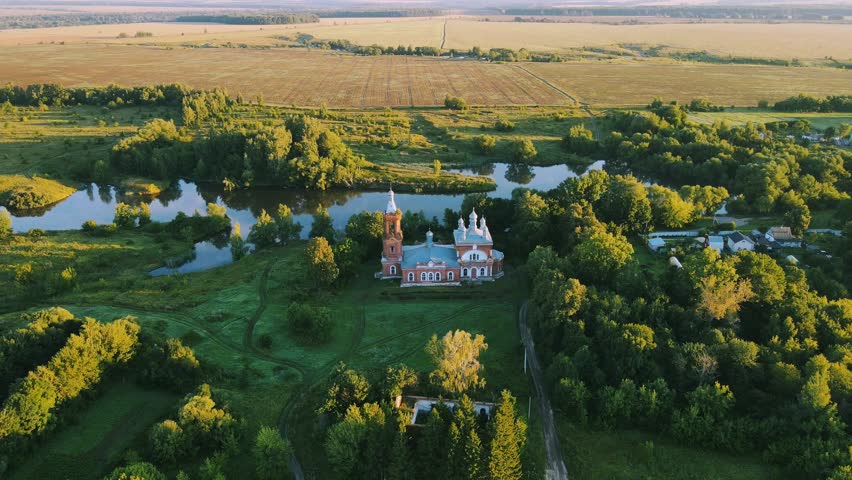 Dawn over the village aerial view of buildings landscape and church