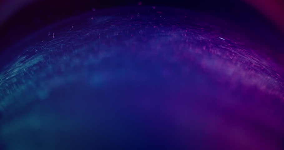 Bokeh glow. Neon light background. Glitter reflection. Defocused blue purple color gradient flare on dark abstract futuristic overlay for intro. Shot on RED Cinema camera. | Shutterstock HD Video #1099451975