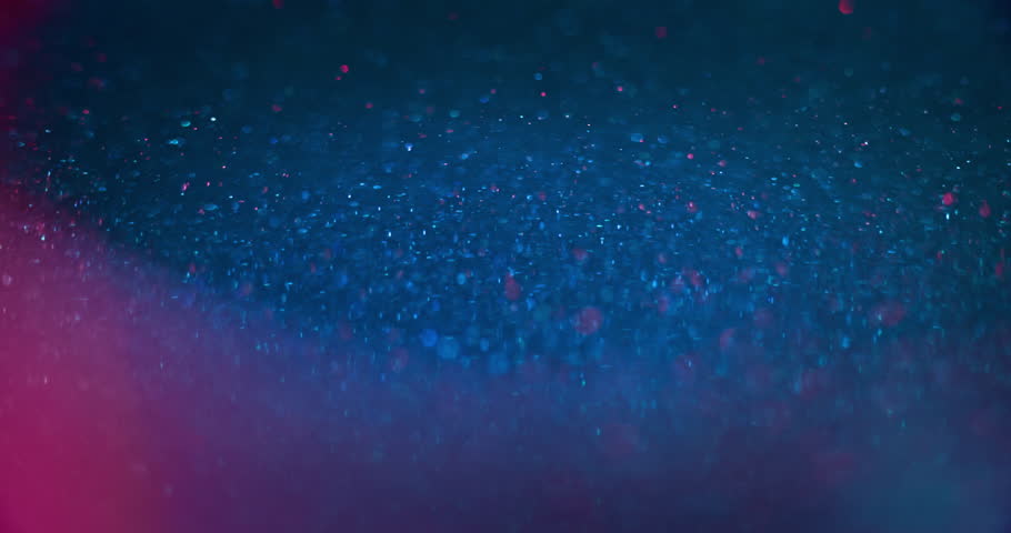 Glitter texture. Neon bokeh light. Sparkling bubbles. Defocused blue magenta pink color glowing circles lens flare on dark abstract background for intro. Shot on RED Cinema camera. | Shutterstock HD Video #1099452051