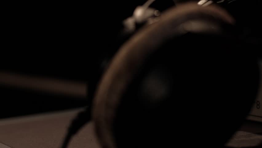 Creator takes headphones close up in recording studio | Shutterstock HD Video #1099455503