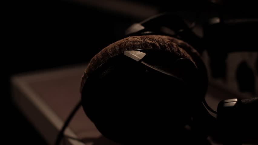 Creator takes headphones close up in recording studio | Shutterstock HD Video #1099455505