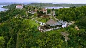 
Orbital landscape video with a drone of the city of Tihany, with Lake Balaton in the background and the hills in the foreground with the village and the abbey