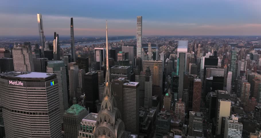 NEW YORK, NY - UNITED STATES - DEC 5 2021: NYC Aerial flies back reveals midtown Manhattan buildings and Queensboro Bridge
