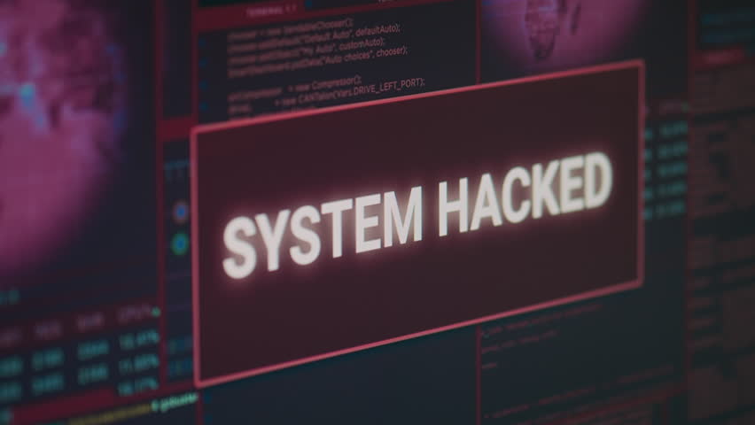 Computer monitor showing hacked system alert message flashing on screen, dealing with hacking and cyber crime attack. Display with security breach warning and malware threat. Close up.