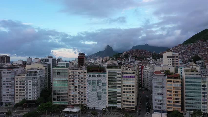 Copacabana and Ipanema Neighborhoods. Cantagalo and Pavao-Pavaozinho Favelas. Rio de Janeiro, Brazil. Aerial View. Drone Flies SIdeways and Upwards Royalty-Free Stock Footage #1099466217
