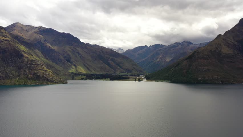 Midway point on Lake Wakatipu in New Zealand – scenic aerial fly 4k.
 | Shutterstock HD Video #1099466417