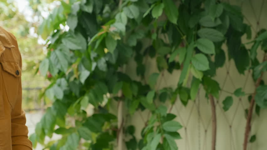 Closeup of two unrecognizable buddies greeting each other with fist bump outdoors
