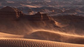 Sand blowing over dunes in wind, red cliffs on background, Gobi desert. Mongolia - Powered by Shutterstock - Get 15% off with code: PIKWIZARD15