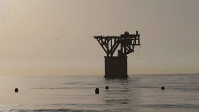 Mining tower silhouette in the mediterranean sea in Marbella, Costa del Sol, Spain