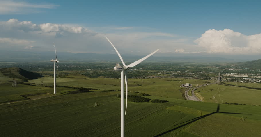 Wind turbine generator farm in agricultural landscape in Gori, Georgia.