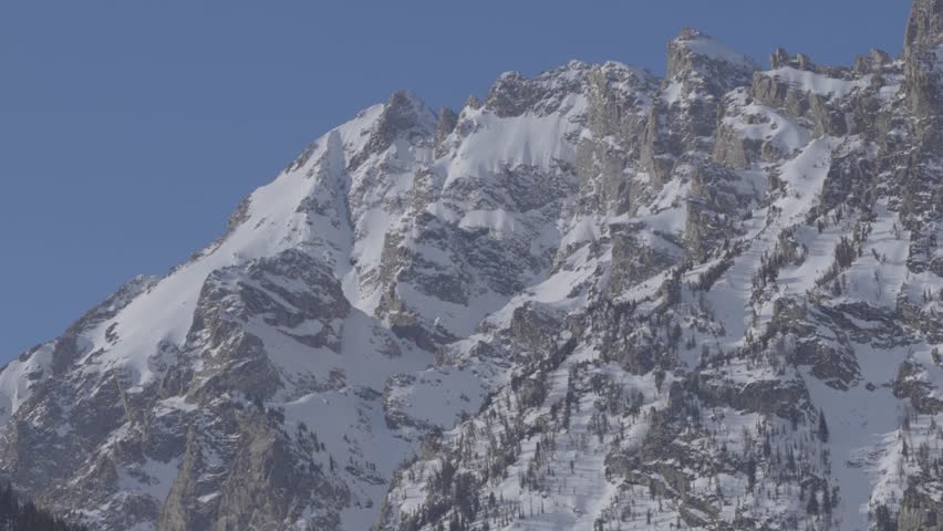 Telephoto shot of high mountain summits in western Wyoming. Shot in 4K