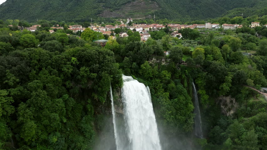 Drone Flying Towards The Foamy Cascades Of Marmore Falls, Cascata Delle Marmore In Umbria Region, Italy. Aerial Shot