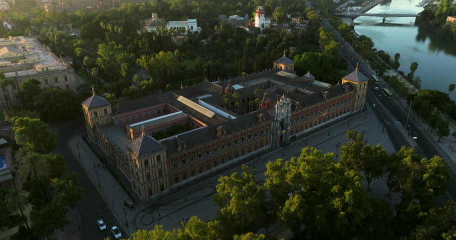 Aerial View Of Palacio de San Telmo, Government Building Along The Canal de Alfonso XIII At Sunrise In Seville, Spain.
