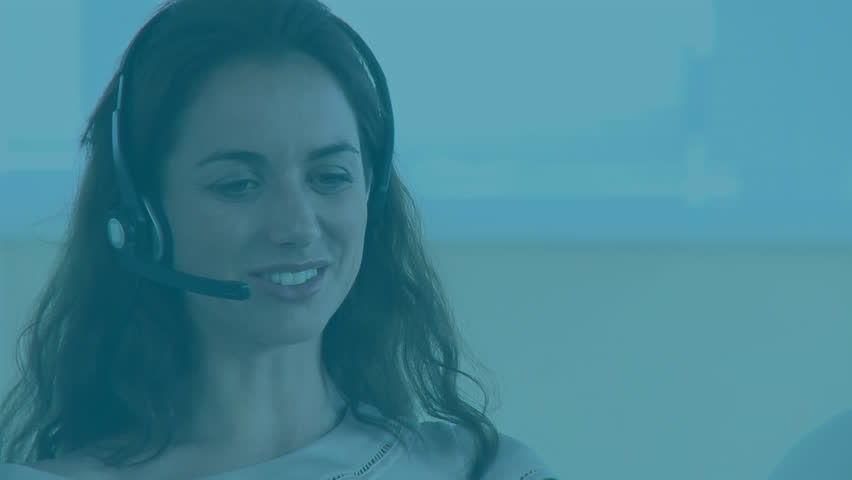 Animation of data processing over caucasian woman using phone headset working in call center. Global communication, computing and digital interface concept digitally generated video.