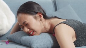 Close Up Of Drunk Asian Woman Wakes Up After Sleeping On A Sofa In The Party Room At Home
 - Powered by Shutterstock - Get 15% off with code: PIKWIZARD15