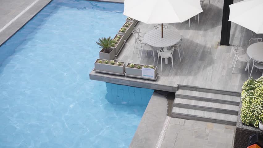 Poolside Cafe Tables in Luxury Resort. Costa Verde, Lima, Peru. Daytime. Slow Motion. | Shutterstock HD Video #1099484059