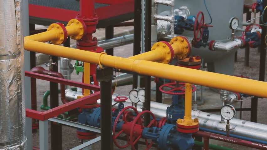 Natural gas production, pumping, transportation and storage plant. Pipeline with gauges, valves, indicators | Shutterstock HD Video #1099490069