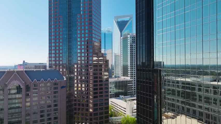 Urban landscape of downtown district of Charlotte city in North Carolina, USA. Skyline with high skyscraper buildings in modern american megapolis