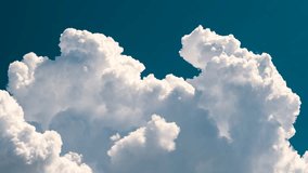 Timelapse of white puffy cumulus clouds forming on summer blue sky. Moving and changing cloudscape weather - Powered by Shutterstock - Get 15% off with code: PIKWIZARD15