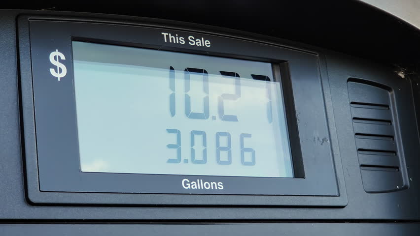 Close up of a gasoline pump at gas station showing dollars payed for gallons of fuel pumped. Screen showing total cost for filling up a car tank. High gas prices | Shutterstock HD Video #1099490573