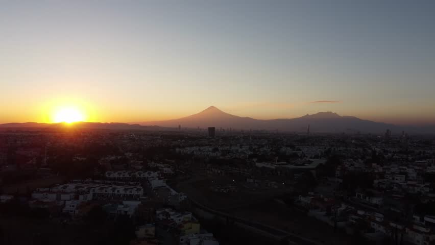 Sunset in Puebla, Mexico, near the Popocatépetl and Iztaccíhuatl volcanoes | Shutterstock HD Video #1099497111