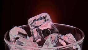 Slow motion 1000 fps on pours water on red ice cubes in rotate glass.Slow motion pours red steam ice cubes on red background.Super slow motion pours neon blue cocktail on spin ice cubes in turn glass - Powered by Shutterstock - Get 15% off with code: PIKWIZARD15