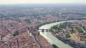 Inscription on video. Verona, Italy. Flying over the historic city center. Castelvecchio Castello Scaligero, summer. Text furry, Aerial View, Point of interest