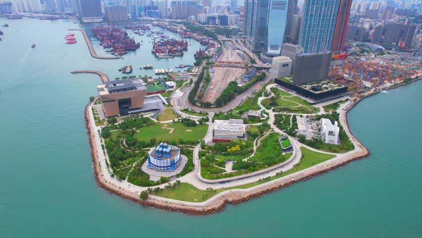 West Kowloon Cultural District, A Waterfront Leisure Promenade Palace Museum Freespace near Central, Victoria Harbour, Hong Kong in the background, Aerial drone Skyview Royalty-Free Stock Footage #1099506975