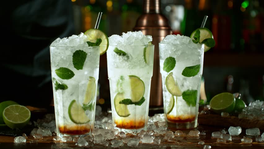 Super slow motion of making mojito cocktail with camera movement. Speed ramp effect. Filmed on high speed cinema camera with cinebot, 1000 fps. Royalty-Free Stock Footage #1099508267