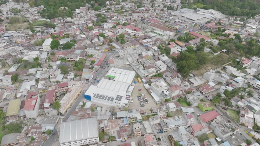 Flying over the houses and downtown of Panajachel, Guatemala. | Shutterstock HD Video #1099516317