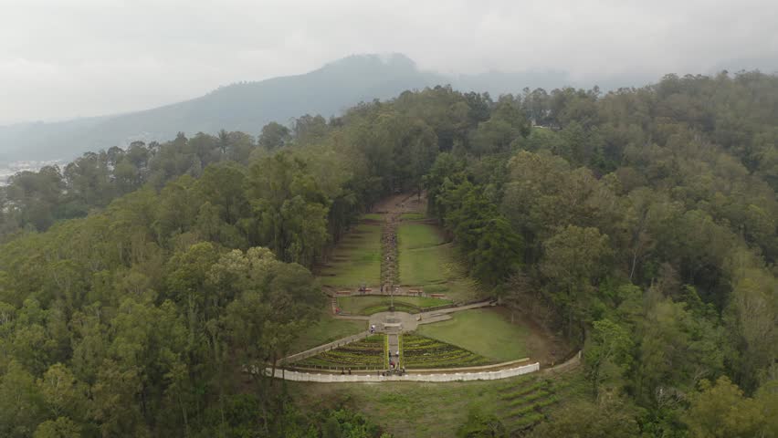 Aerial view in front of the Cerro de La Cruz monument, low visibility in Antigua, Guatemala - static, drone shot | Shutterstock HD Video #1099516351