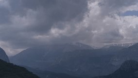 Time lapse video of clouds moving over mountains Turkey, Antalya. Mediterranean Sea. Clouds over the mountains and scratch the tops of the mountains. Landscape and cloudscape. Aerial view of Mountains