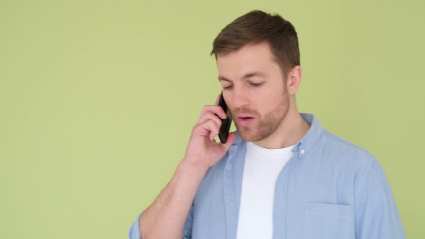 The angry guy says on the phone and shouts WHAT | Shutterstock HD Video #1099518881