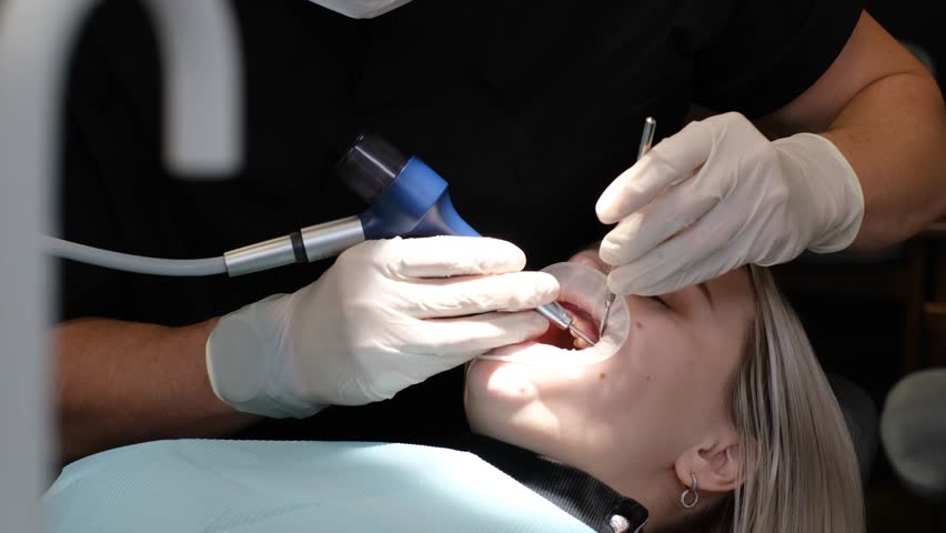 Dentist in process. Dental services, dental office.  | Shutterstock HD Video #1099518959